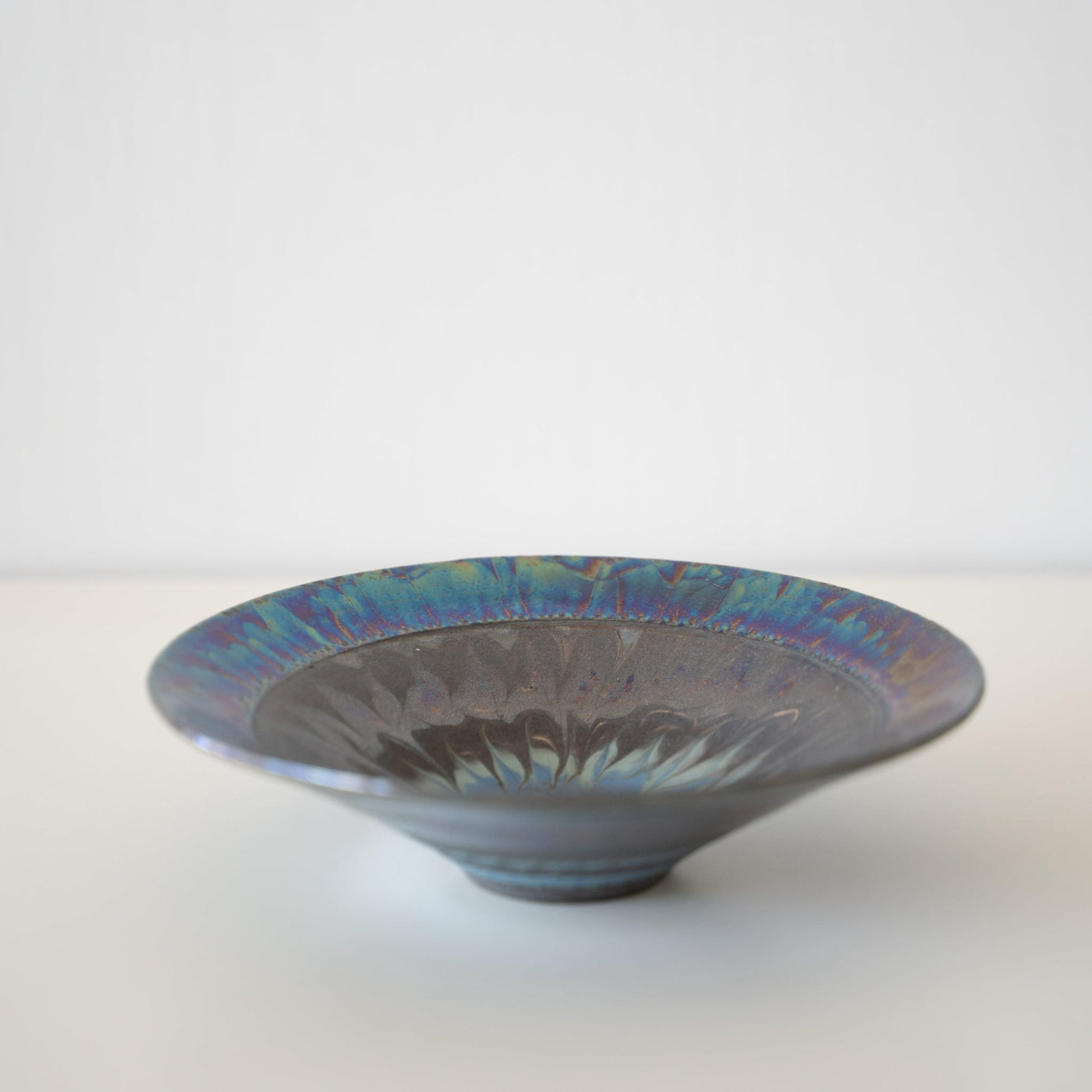 Side view of Kintsugi Bowl "Blue Rose Nebula" in a white background