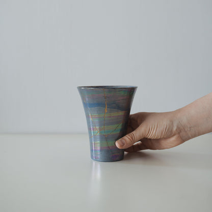 Hand holding Kintsugi Cup "Sirius", showing its size and how it fits in the hand