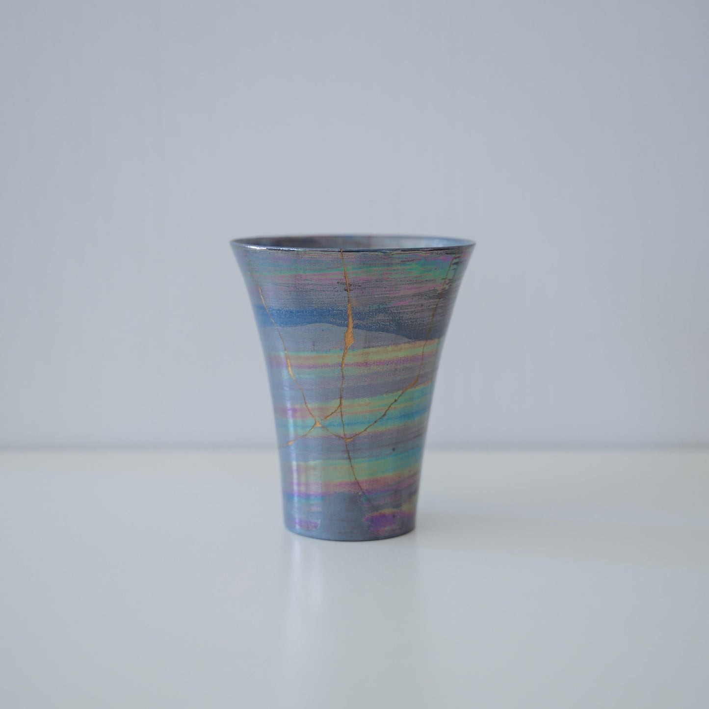 Side view of Kintsugi Cup "Sirius" in a white background