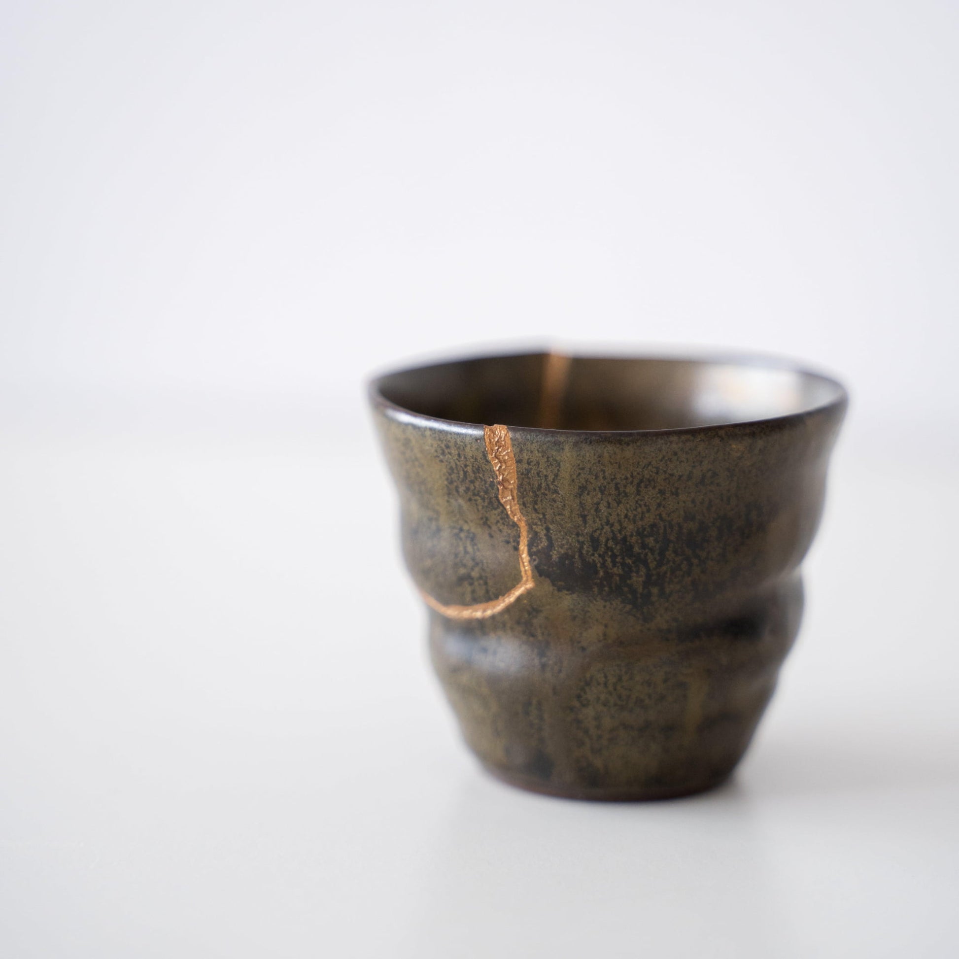 Close-up of Kintsugi repair on Kintsugi Sake Cup "Thunder Moss"