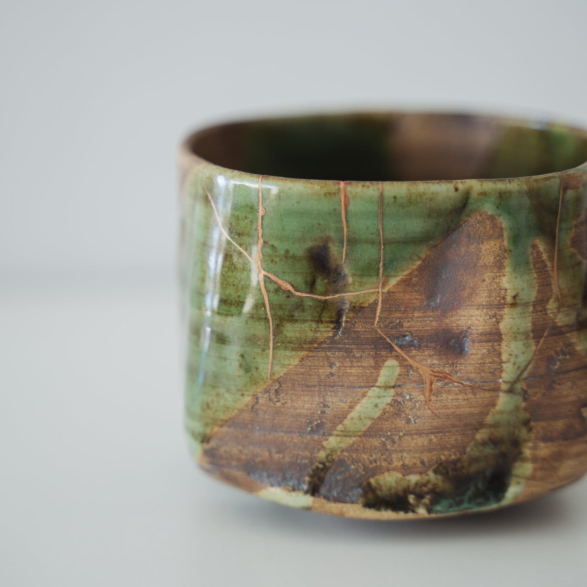 Close-up of Kintsugi repair on Kintsugi Tea Bowl "Valley Oribe"