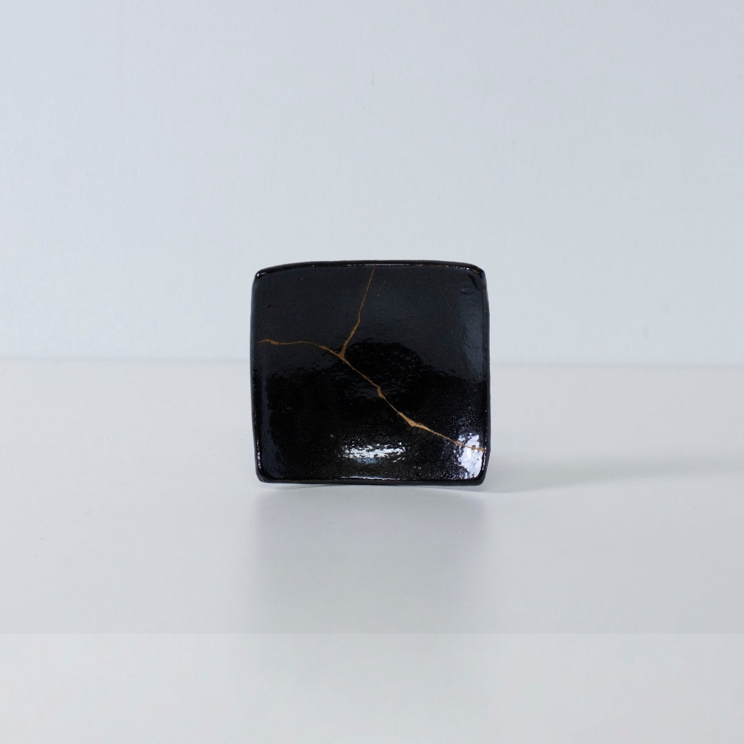 Side view of Kintsugi Square Plate "Jet Black Lighting" 02 in a white background
