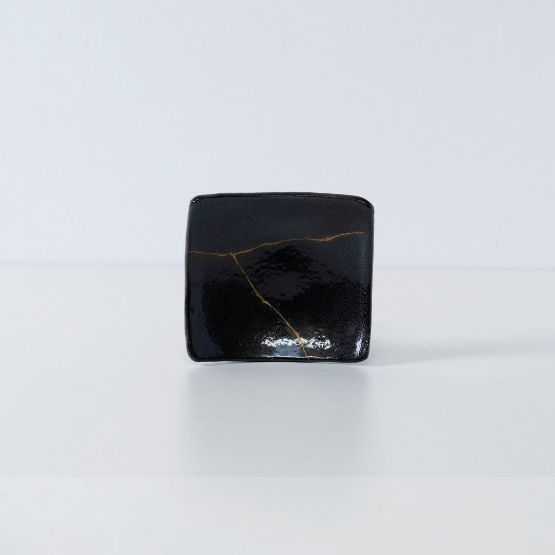 Side view of Kintsugi Square Plate "Jet Black Lighting" 04 in a white background