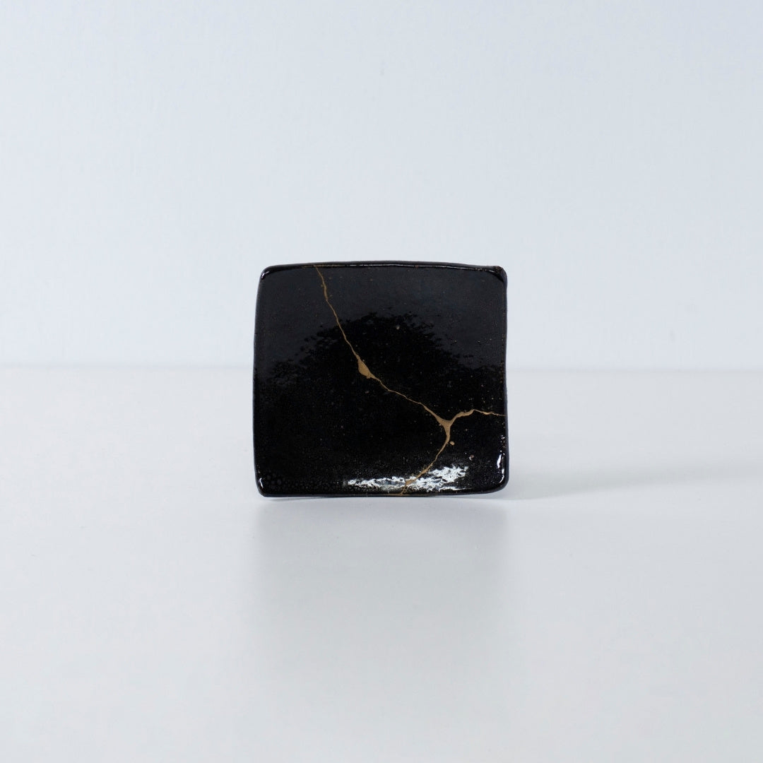Side view of Kintsugi Square Plate "Jet Black Lighting" 05 in a white background