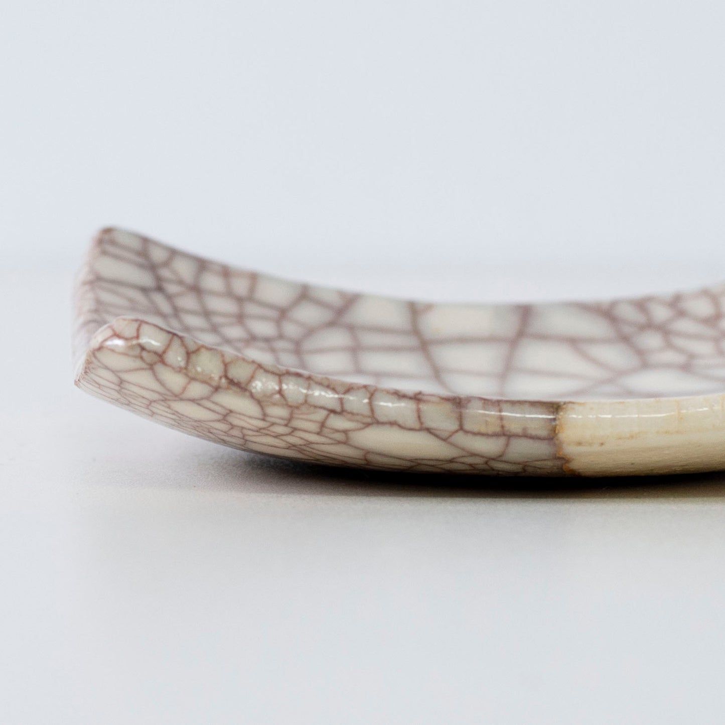 Close-up of the side profile of Kintsugi Square Plate "Vermilion Crackle" 04, highlighting the texture.