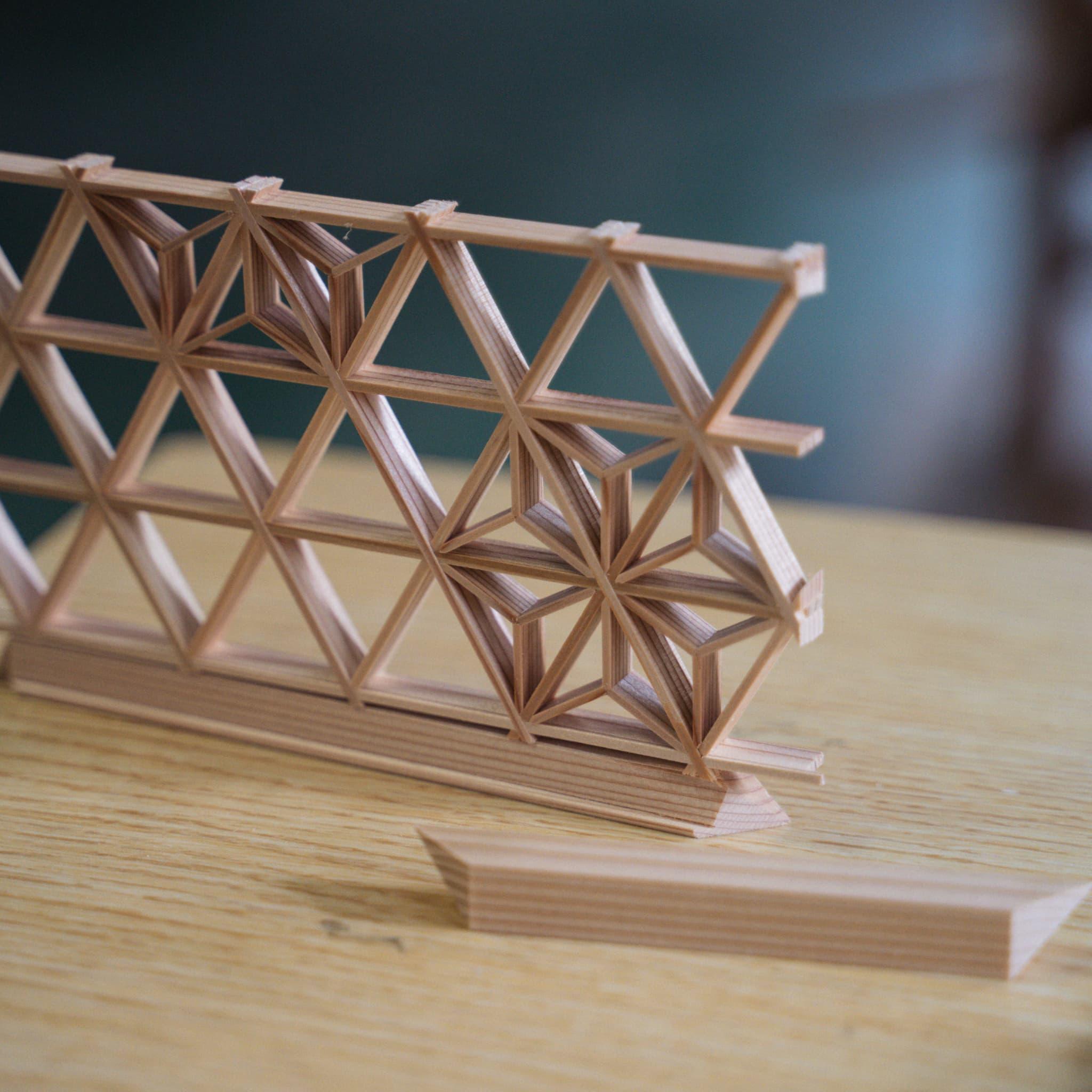 Pieces of Akita cedar, the material used for creating the delicate geometric patterns in kumiko craftsmanship, and individual kumiko components.