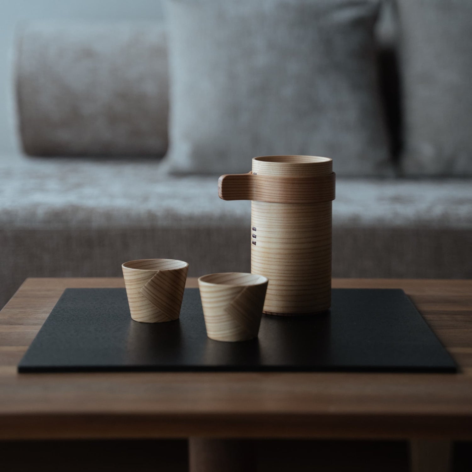 Japanese cedar sake cup set on a wooden table