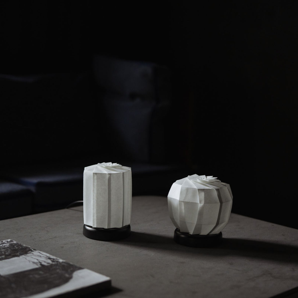 Japanese Origami Paper Table Lamp on a gray table in a Japandi room