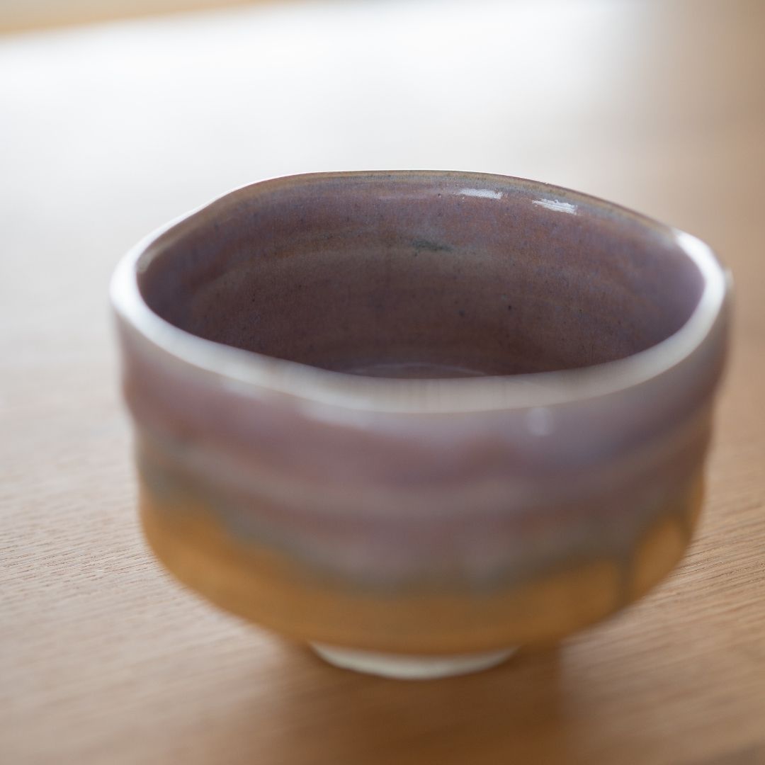 Soft focus view of the unique Pale Violet Haze Mino Ware matcha bowl, handcrafted by Shinzan Kiln in Gifu, Japan.