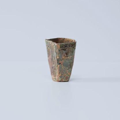 Side view of Pentagon Kintsugi Cup "Oribe" Deep Green 02 against white background