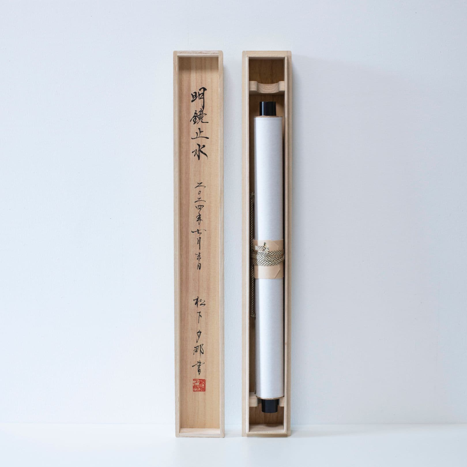 Japanese scroll stored in long wooden box with matching lid