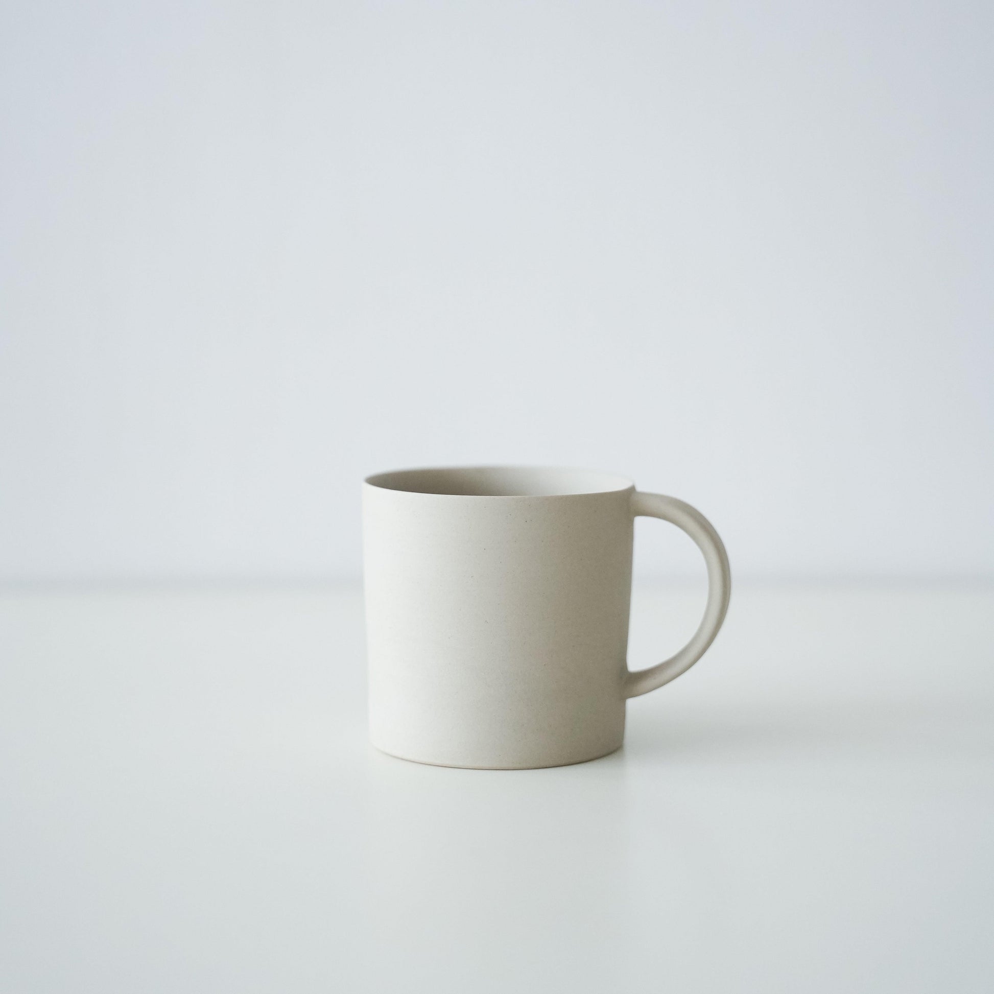 A simple white Banko ware mug.