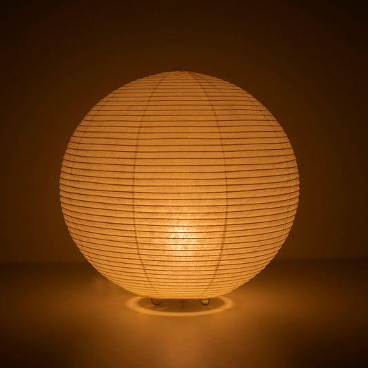 The Japanese paper floor lamp "paper moon 05" glowing warmly – handcrafted Washi Japanese lamp
