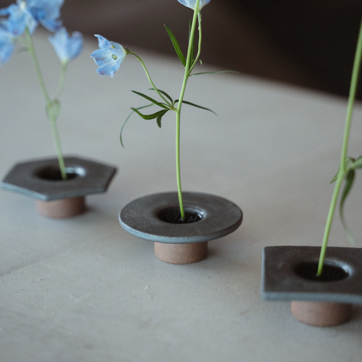 Japanese ikebana vases with blue flowers