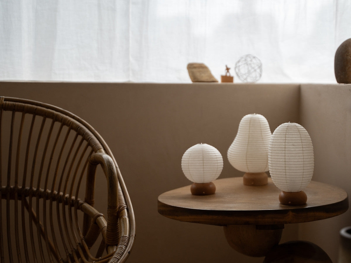 Three Japanese Paper Table Lamps on wooden table in Japandi style living room – Japandi paper lanterns for bedroom & living room