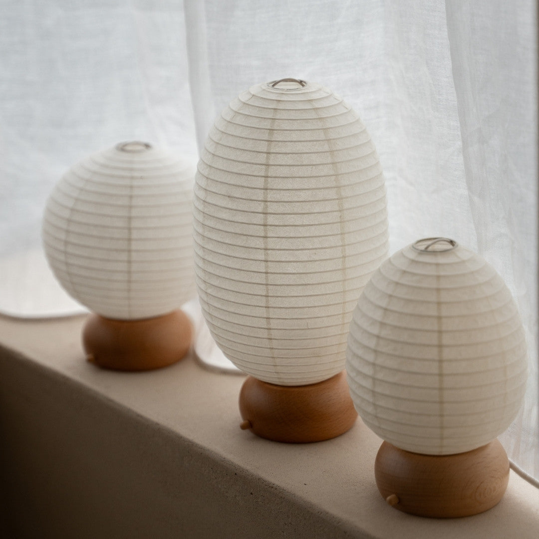 Three Rounded Japanese Paper Table Lamps on window sill – Japandi style portable lamps for bedroom & living room