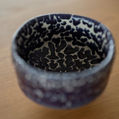 Overhead view focused on the stunning, deep blue Kairagi glaze inside the Japanese Matcha Bowl, a handcrafted wabi sabi chawan by Shinzan Kiln.
