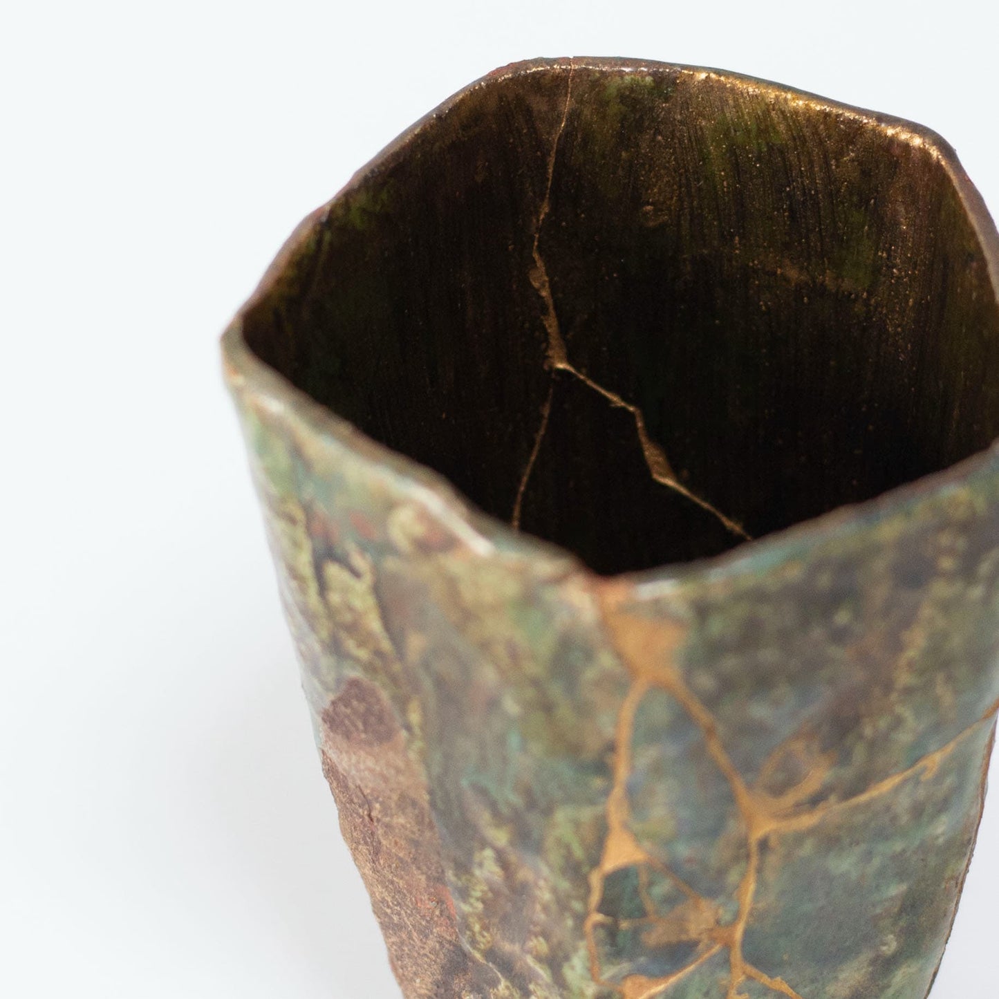 Top view of Pentagon Kintsugi Cup "Oribe" Deep Green 02, showcasing its unique pentagonal shape