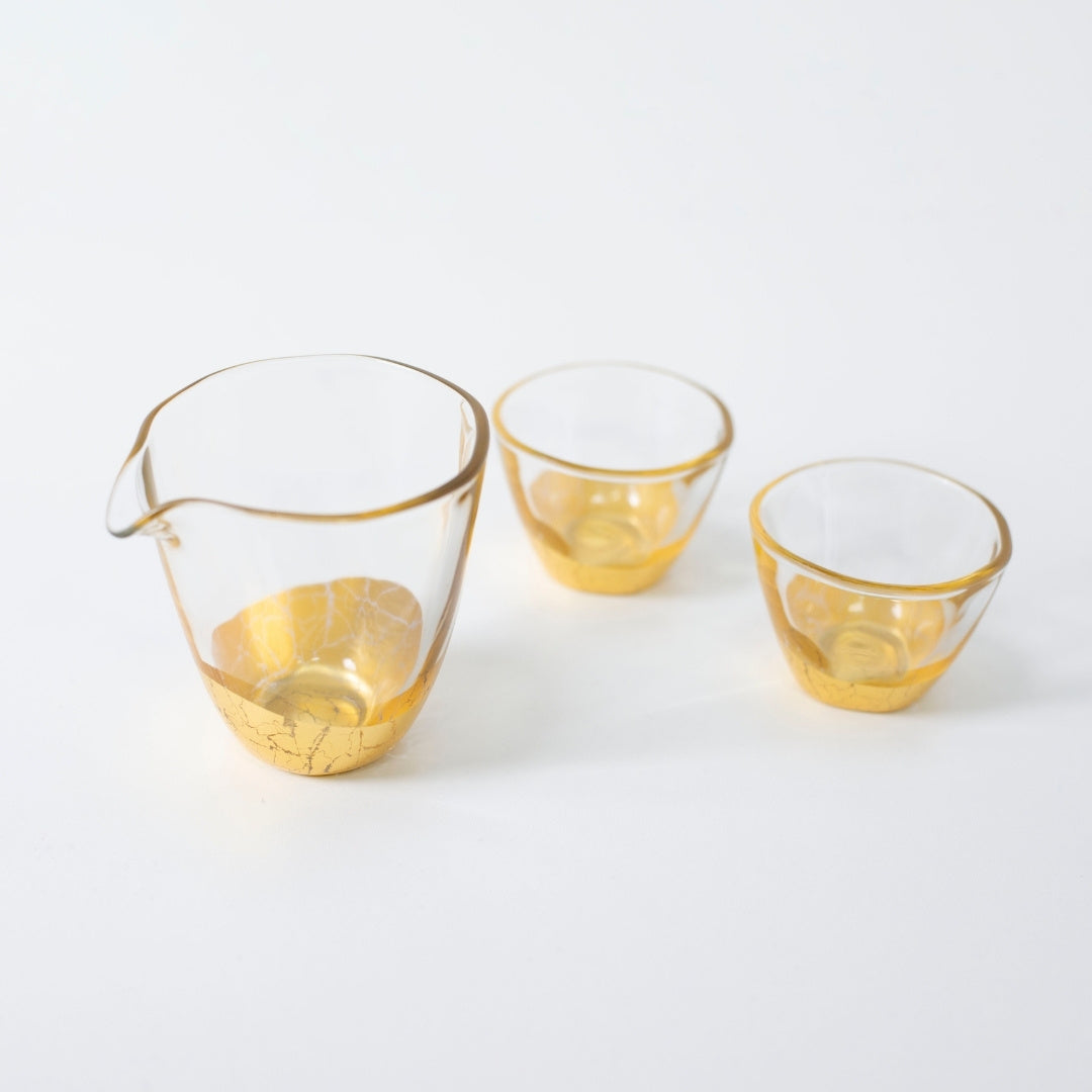 Top view of Japanese sake set with gold leaf, sake bottle and cups by HAKUICHI, Japan craftsmanship