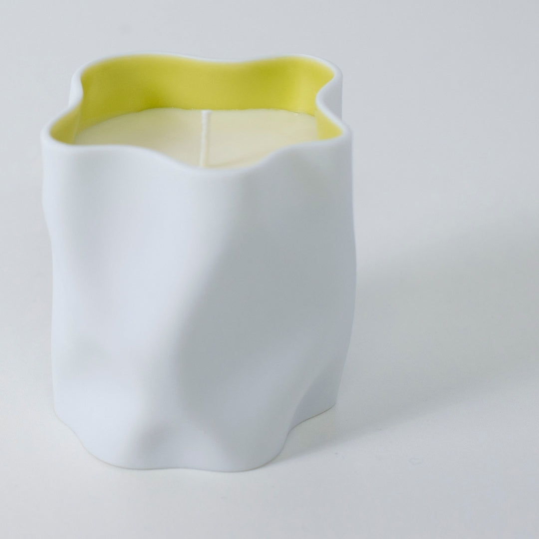 Top view of Japanese candle YUZU with citrus yuzu, jasmine, and Japanese Incense in white ceramic vessel