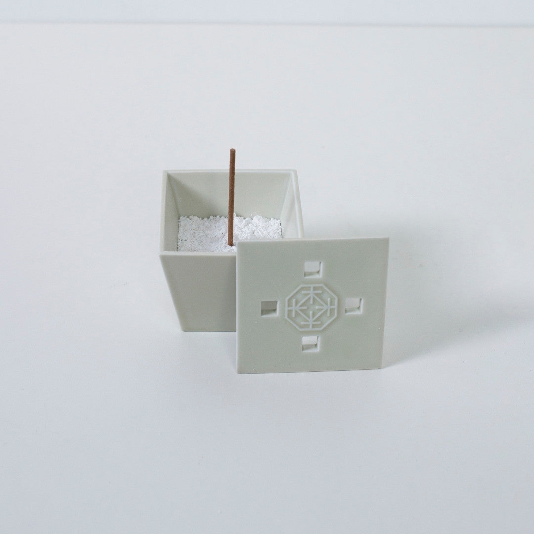 Top view of PORCELAIN INCENSE BURNER WHITE with incense stick - Sophisticated ceramic incense holder for Japandi decor
