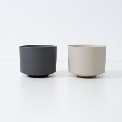 Set of two Japanese matcha bowls in black and white, minimalist Banko ware matcha chawan bowls.