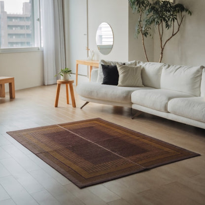 Japanese Tatami Area Rug "Ranks" Burgundy on a wooden floor, adding an elegant touch to a modern living room for relaxation.
