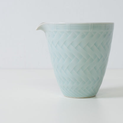 Basket weave sake carafe, ice blue, porcelain - Close up of a Japanese sake carafe showing the woven pattern
