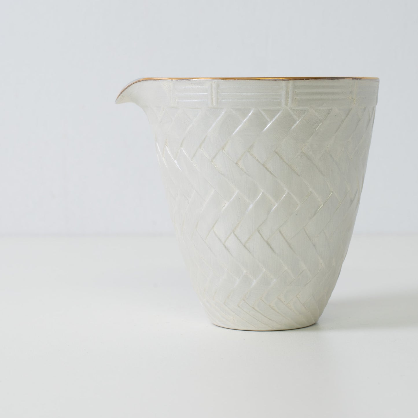 Basket weave sake carafe, white porcelain - Close up of traditional Japanese sake carafe with textured surface