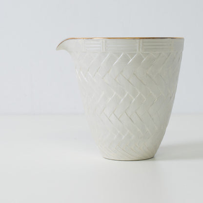 Basket weave sake carafe, white porcelain - Close up of traditional Japanese sake carafe with textured surface