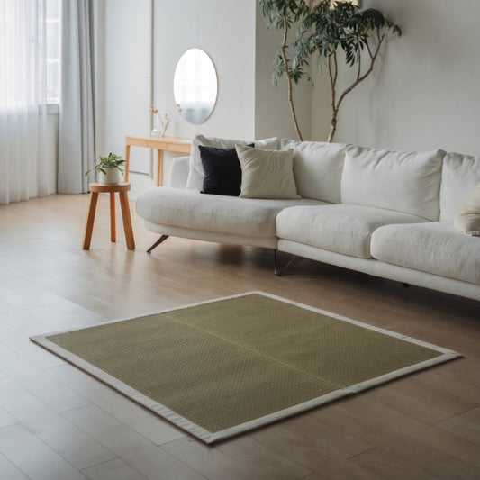 Square Japanese Tatami Area Rug "MUKU" Natural on a wooden floor, bringing minimalist calm to a modern living room.