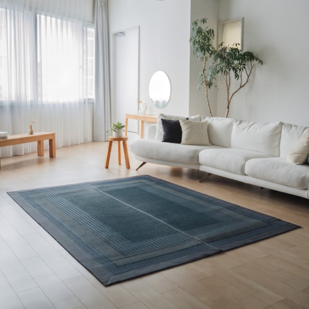 Japanese Tatami Area Rug "Ranks" Indigo Navy on a wooden floor in a bright living room for spacious mindful relaxation.