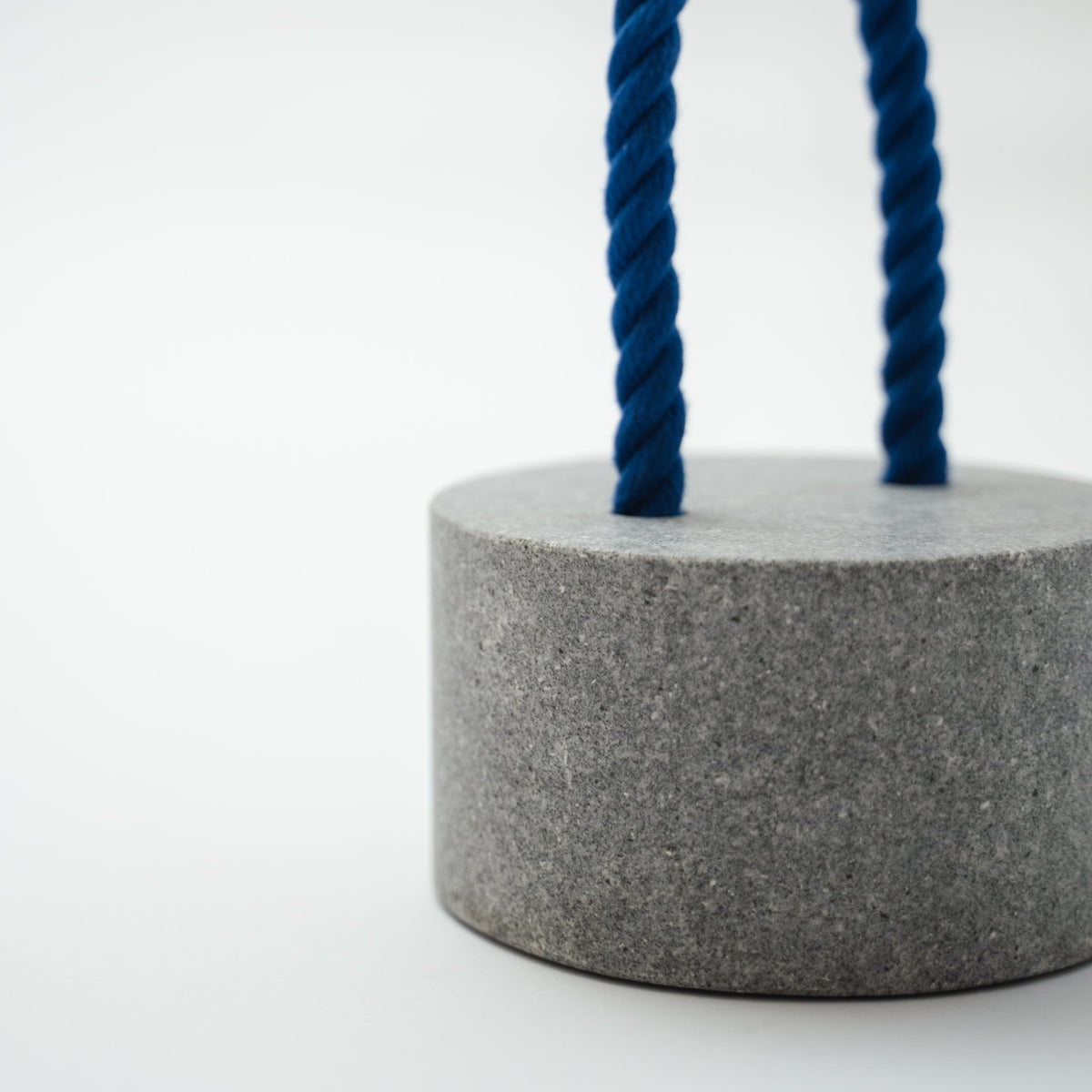 Detail view of Japanese Aji Stone Doorstop "FUJ" in gray.