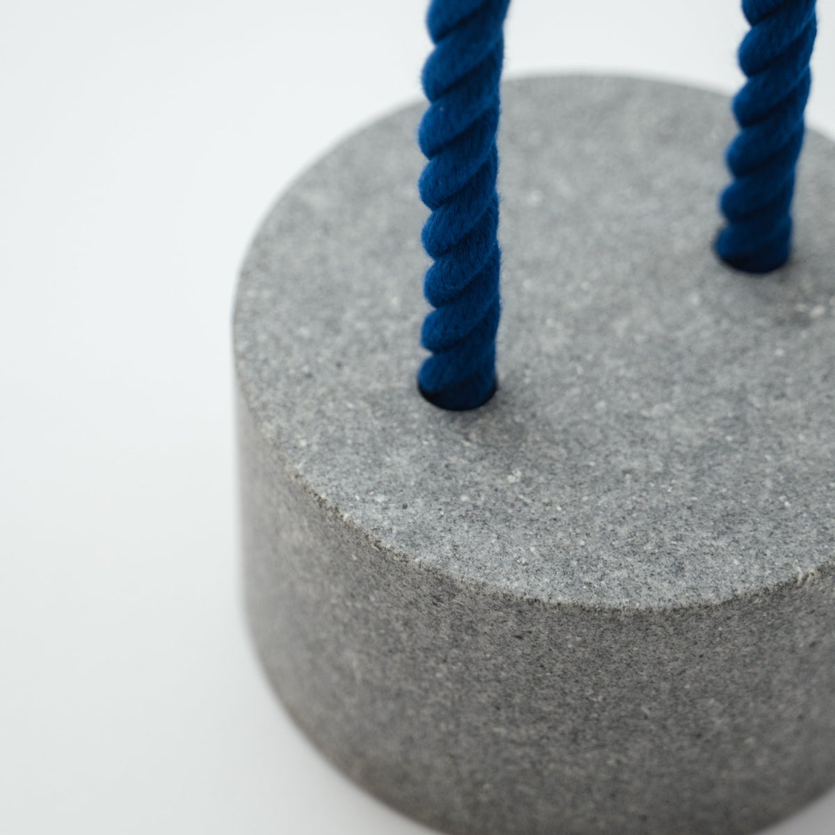 Detail view of Japanese Aji Stone Doorstop "FUJ" in gray.
