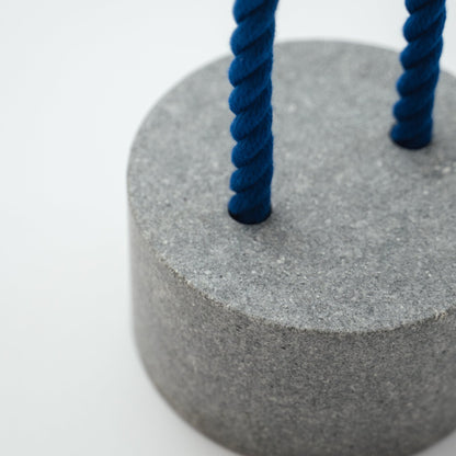 Detail view of Japanese Aji Stone Doorstop "FUJ" in gray.