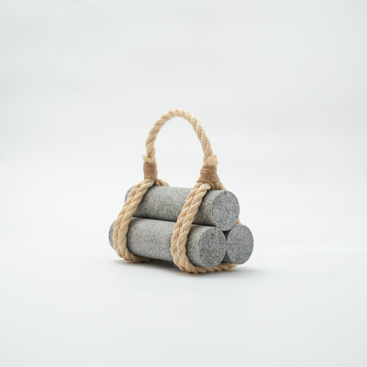 Japanese Aji Stone Doorstop "komame" in gray, front view.