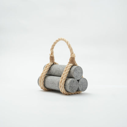 Japanese Aji Stone Doorstop "komame" in gray, front view.