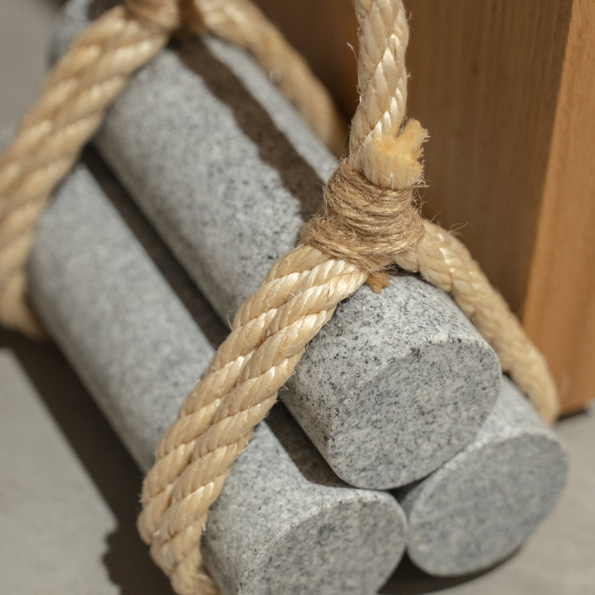 Japanese Aji Stone Doorstop "komame" in natural stone styled in a styled room, detail lifestyle view.