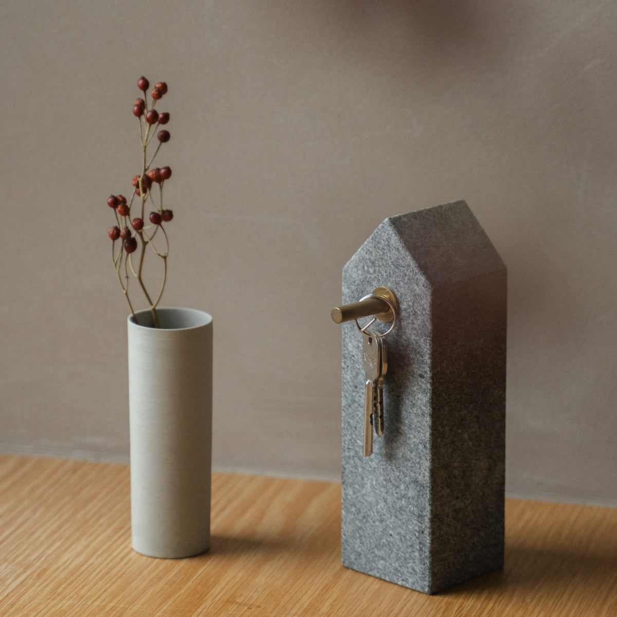 Japanese Aji Stone Key Holder in natural stone styled in a entryway setting, entryway scene view.