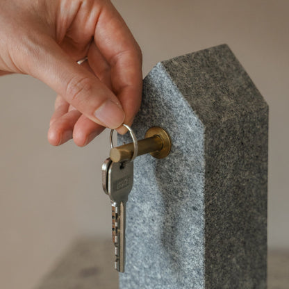 Japanese Aji Stone Key Holder in natural stone styled in a styled room, detail lifestyle view.