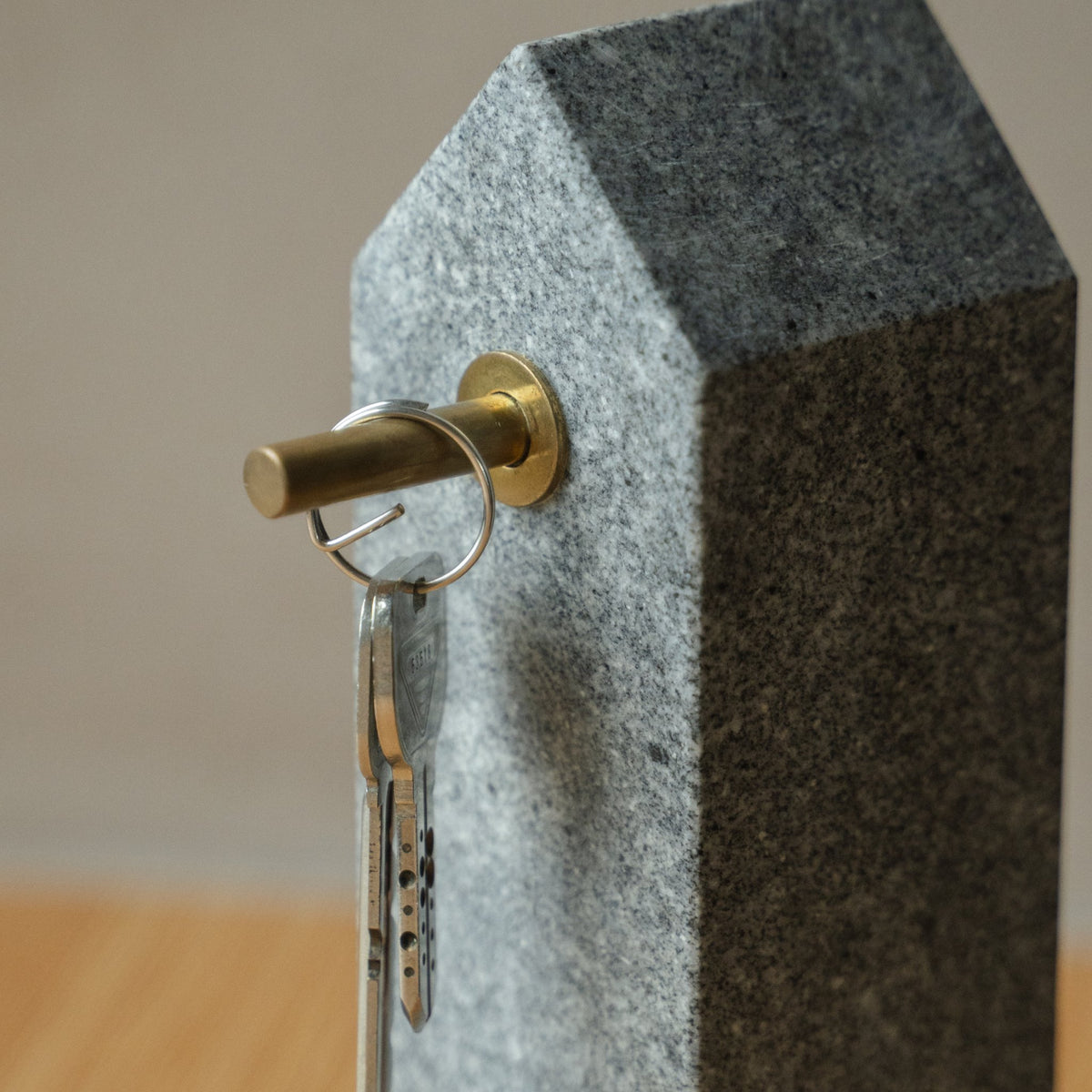 Japanese Aji Stone Key Holder in natural stone styled in a styled room, detail lifestyle view.