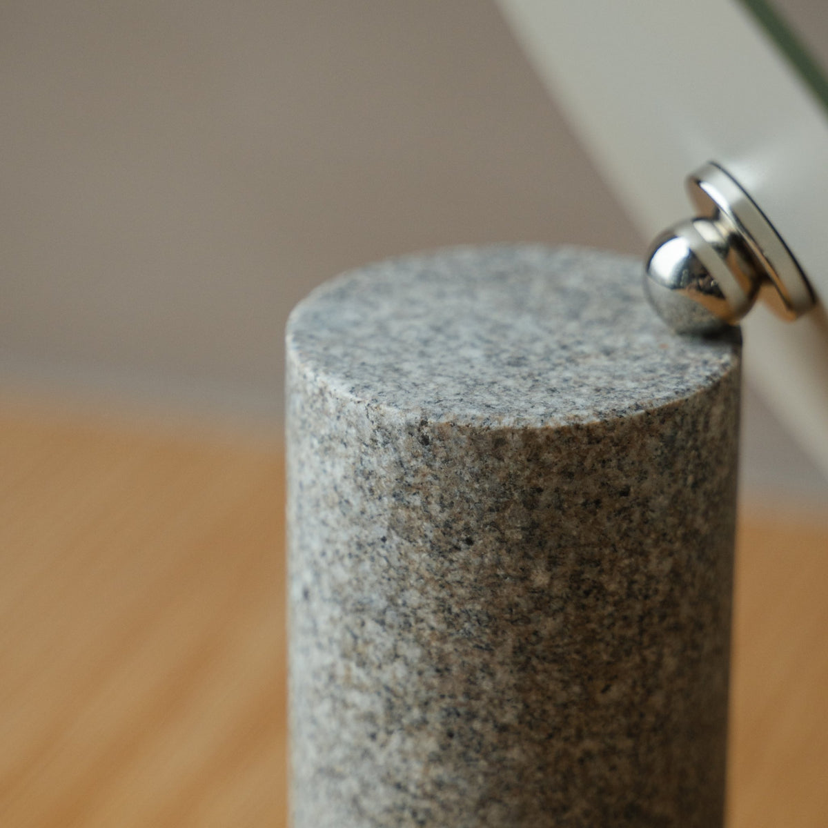 Japanese Aji Stone Table Mirror in natural stone styled in a styled room, detail lifestyle view.