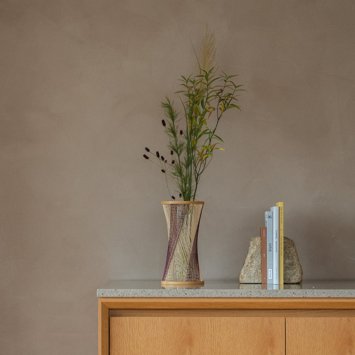 Japanese Bamboo Flower Vase "Fleeting Moment" in brown & purple styled in a console table setting, console scene view.
