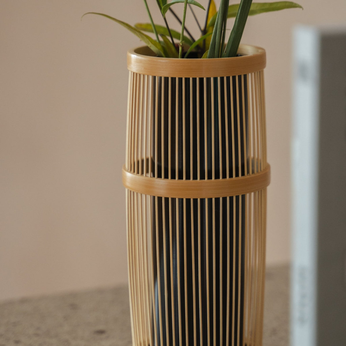 Japanese Bamboo Flower Vase "Shiori" in brown styled in a styled room, detail lifestyle view.