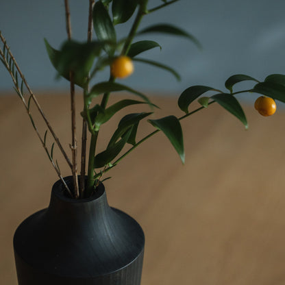 Japanese Cedar Ikebana Vase Indigo 02 in navy styled in a dining room setting, dining scene view.