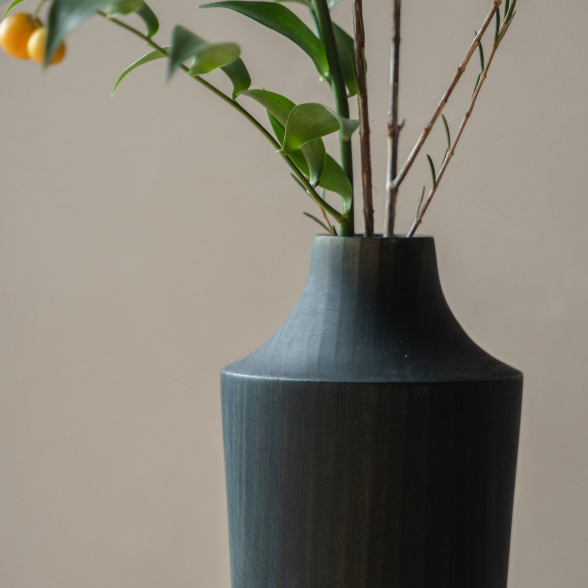 Japanese Cedar Ikebana Vase Indigo 02 in navy styled in a entryway setting, entryway scene view.