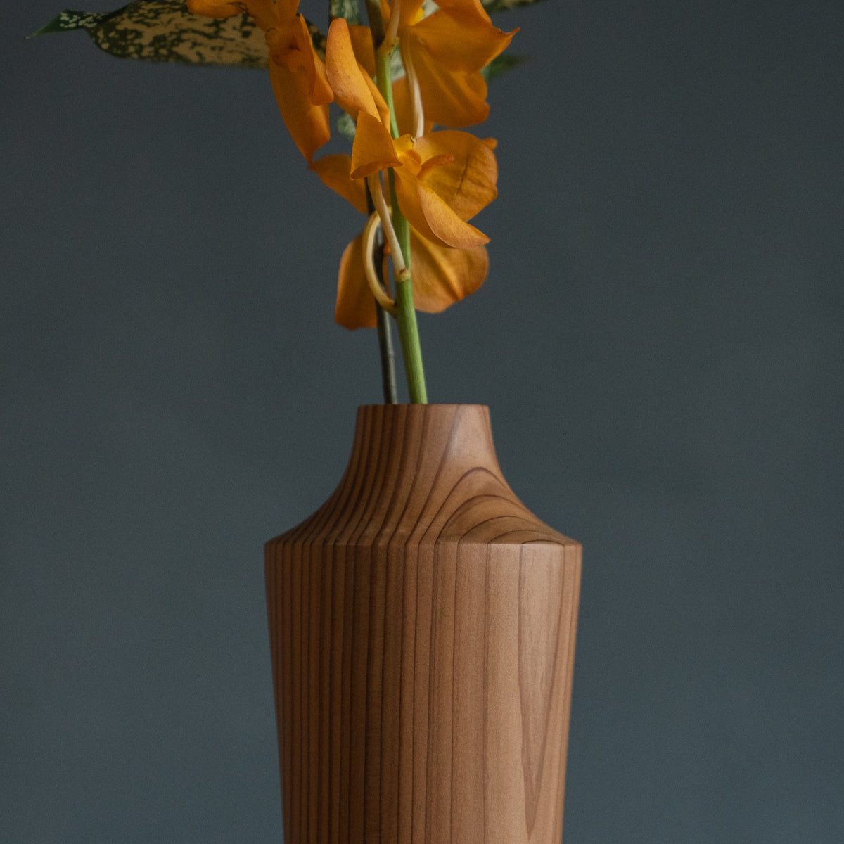 Japanese Cedar Ikebana Vase Natural Wood 02 in brown styled in a dining room setting, dining scene view.