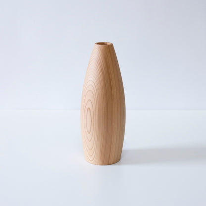 A minimalist cedar wood Ikebana vase showcasing the natural beauty of the wood grain.
