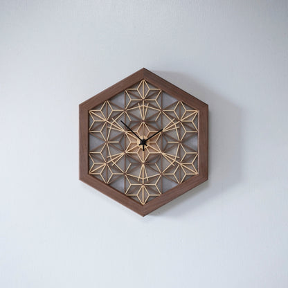 A luxurious kumiko clock made from walnut wood. The intricate design is crafted by hand, showcasing the beauty of traditional Japanese woodworking.