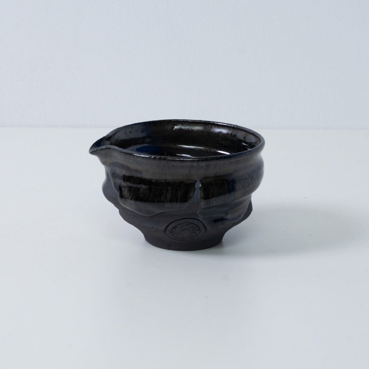 Japanese matcha bowl with spout "Dignity Blue" pottery from Japan, featuring an engraved artisan seal on the side.